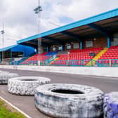 Central Park, home of Cowdenbeath, where monster truck tyres separate the football pitch from the stock car racing track.