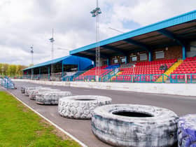 Central Park, home of Cowdenbeath, where monster truck tyres separate the football pitch from the stock car racing track.