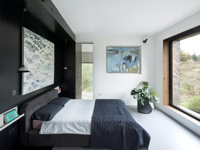 The kitchen and living spaces are pushed to the outer edges of the home. It has an emphasis on sustainability and the environment with windows capitalising on solar heat energy.