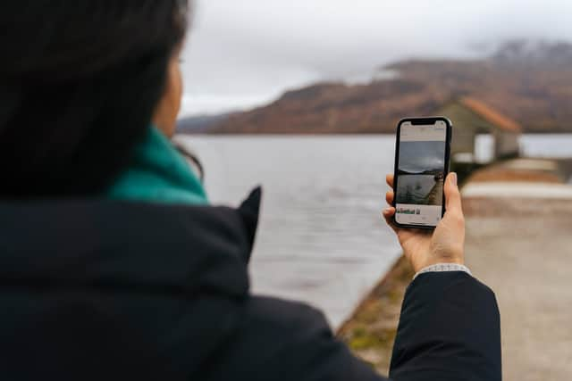 Supervising location manager Lloret MacKenna Dunn, here at Loch Katrine, uses 5G technology to communicate with others on her team and productions, making the process faster and easier.