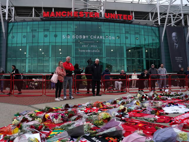 A general view of floral tributes to Sir Bobby Charlton placed at Old Trafford.