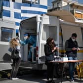 People get a free rapid test for Covid-19 in an Athens' southern suburb.