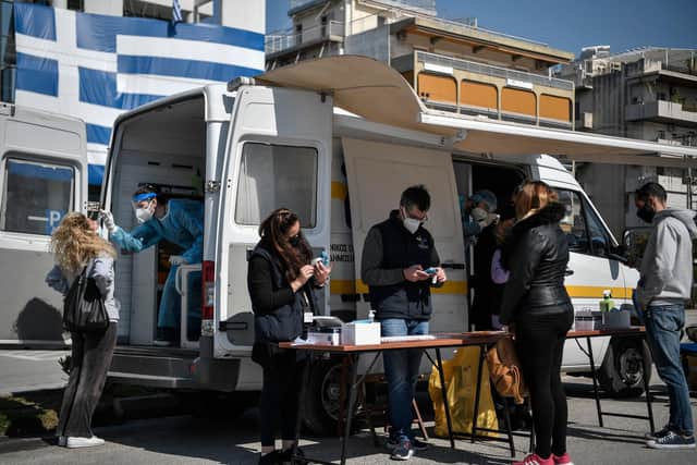 People get a free rapid test for Covid-19 in an Athens' southern suburb.