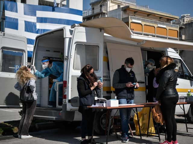 People get a free rapid test for Covid-19 in an Athens' southern suburb.