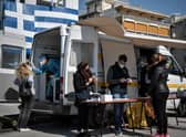 People get a free rapid test for Covid-19 in an Athens' southern suburb.