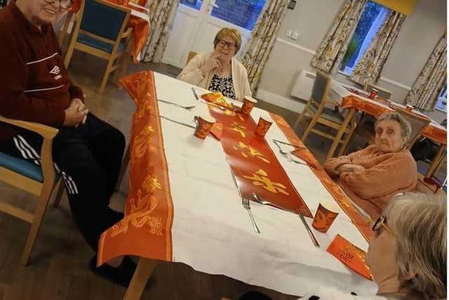Darnley Court residents discussing Chinese New Year ahead of their meal