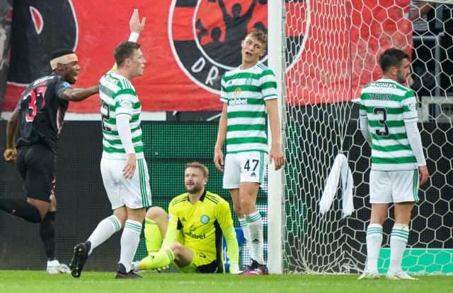 Celtic's Dane Murray (centre) looks dejected after Awer Mabil makes it 1-1 at the MCH Arena. (Photo by Claus Fisker / SNS Group)