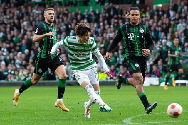 Kyogo Furuhashi slides the ball home to put Celtic ahead against Ferencvaros.
