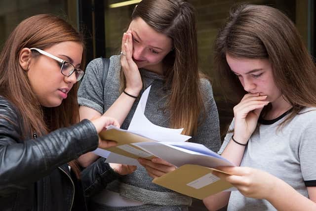 Pupils receive their results. Photo by Dan Kitwood/Getty Images