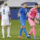 Players react to the draw at the end of the 2022 FIFA World Cup qualifier group F football match between Israel and Scotland at Bloomfield stadium in the Israeli Mediterranean coastal city of Tel Aviv on March 28, 2021. (Photo by JACK GUEZ / AFP) (Photo by JACK GUEZ/AFP via Getty Images)