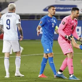 Players react to the draw at the end of the 2022 FIFA World Cup qualifier group F football match between Israel and Scotland at Bloomfield stadium in the Israeli Mediterranean coastal city of Tel Aviv on March 28, 2021. (Photo by JACK GUEZ / AFP) (Photo by JACK GUEZ/AFP via Getty Images)