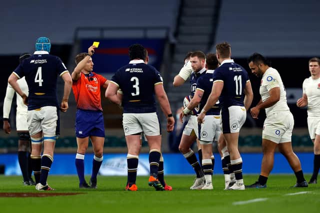 Referee Andrew Brace shows a yellow card to England's Billy Vunipola during the Six Nations match against Scotland at Twickenham in 2021.  (Photo by ADRIAN DENNIS/AFP via Getty Images)