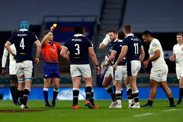 Referee Andrew Brace shows a yellow card to England's Billy Vunipola during the Six Nations match against Scotland at Twickenham in 2021.  (Photo by ADRIAN DENNIS/AFP via Getty Images)