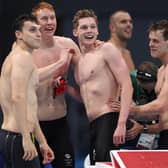 Duncan Scott, centre, grins in triumph alongside Team GB team-mates Tom Dean, James Guy and Matthew Richards after their triumph in the men's 4 x 200m freestyle relay final on day five of the Tokyo 2020 Olympic Games. Picture: Tom Pennington/Getty Images