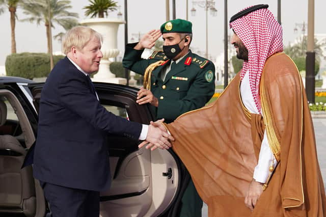 Boris Johnson shakes hands with Crown Prince Mohammed bin Salman during a visit to Saudi Arabia in March (Picture: Stefan Rousseau/pool/AFP via Getty Images)