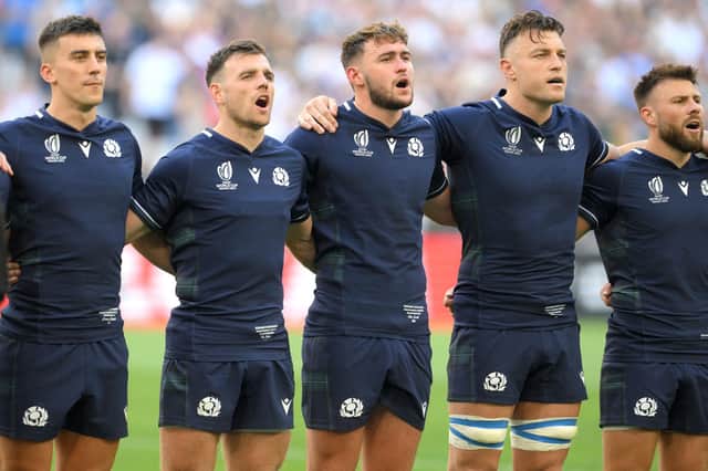 Scotland's players line up for the national anthems ahead of their Rugby World Cup opener against South Africa. (Photo by NICOLAS TUCAT/AFP via Getty Images)