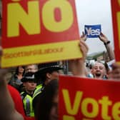 Supporters of the Yes and No campaigns gather outside Dumbarton Town Hall in September 2014 ahead of the Scottish independence referendum (Picture: Peter Macdiarmid/Getty Images)