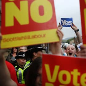 Supporters of the Yes and No campaigns gather outside Dumbarton Town Hall in September 2014 ahead of the Scottish independence referendum (Picture: Peter Macdiarmid/Getty Images)