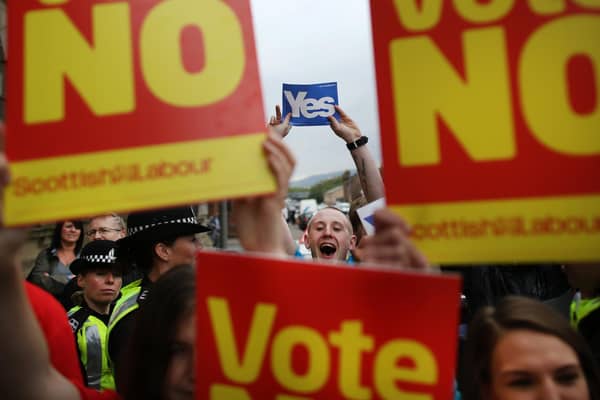 Supporters of the Yes and No campaigns gather outside Dumbarton Town Hall in September 2014 ahead of the Scottish independence referendum (Picture: Peter Macdiarmid/Getty Images)