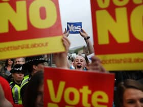 Supporters of the Yes and No campaigns gather outside Dumbarton Town Hall in September 2014 ahead of the Scottish independence referendum (Picture: Peter Macdiarmid/Getty Images)