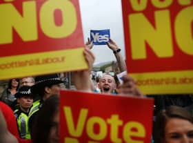 Supporters of the Yes and No campaigns gather outside Dumbarton Town Hall in September 2014 ahead of the Scottish independence referendum (Picture: Peter Macdiarmid/Getty Images)