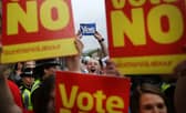 Supporters of the Yes and No campaigns gather outside Dumbarton Town Hall in September 2014 ahead of the Scottish independence referendum (Picture: Peter Macdiarmid/Getty Images)