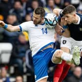 Scotland's Ryan Christie (R) and Cyprus' Valentin Roberge during a UEFA Euro 2024 Qualifier between Scotland and Cyprus at Hampden Park, on March 25, 2023, in Glasgow, Scotland. (Photo by Craig Williamson / SNS Group)