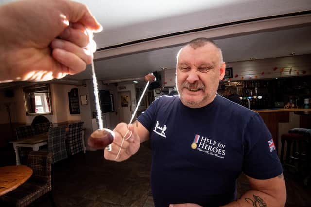 Stuart Ward gets some practice in with a conker, in preparation for the the Bourne Arms Knott End and Preesall World Conkers Championship