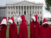 Supporters of sexual health body Planned Parenthood dress as characters from The Handmaid's Tale as they protest outside the US Senate (Picture: Saul Loeb/AFP via Getty Images)