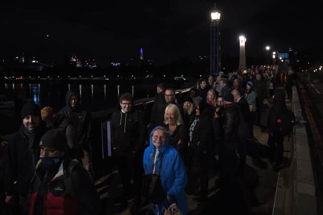 Members of the public in the queue at 03:07 on Lambeth Bridge in London, as they wait to view Queen Elizabeth II lying in state ahead of her funeral on Monday. Picture date: Friday September 16, 2022.