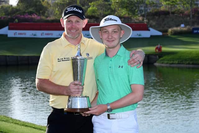 Stephen Gallacher celebartes with son/caddie Jack after winning the 2019 Hero Indian Open at the DLF Golf & Country Club in New Delhi. Picture: Ross Kinnaird/Getty Images.