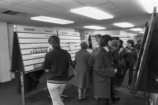 People looking at the job vacancy cards in an Edinburgh JobCentre in June 1981.