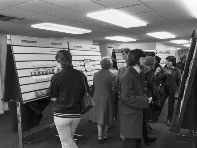 People looking at the job vacancy cards in an Edinburgh JobCentre in June 1981.