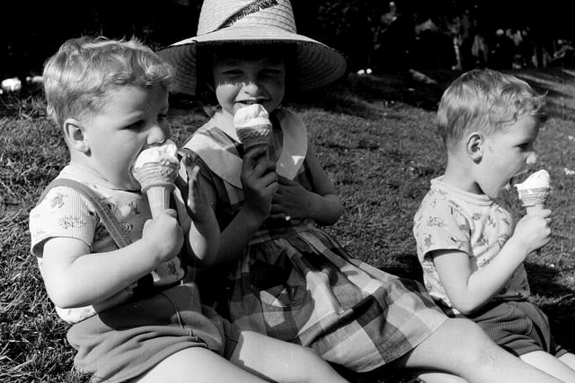 Some happy children are pictured enjoying the summer with ice creams in Princes Street Gardens in June 1965.