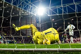 Hearts goalkeeper Craig Gordon saves Ayo Obileye's decisive penalty in the shootout. (Photo by Ross Parker / SNS Group)