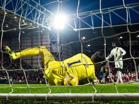 Hearts goalkeeper Craig Gordon saves Ayo Obileye's decisive penalty in the shootout. (Photo by Ross Parker / SNS Group)