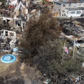 An aerial view shows a Union Flag flying among the the rubble and destruction in a residential area, following a large blaze the previous day in Wennington, Greater London. Picture: Leon Neal/Getty Images