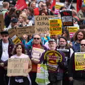 Protesters hold banners during a "Stop the Far Right" demonstration at George Square in Glasgow, Scotland.