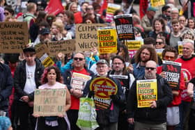 Protesters hold banners during a "Stop the Far Right" demonstration at George Square in Glasgow, Scotland.