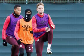 Hearts defender Frankie Kent limbers up for Celtic during training on Friday morning.