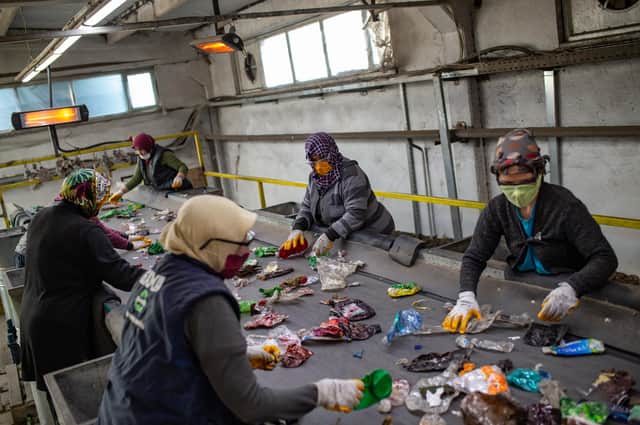 Employees work at the Gama recycling factory in the southern Turkish province of Gaziantep (Picture: Yasin Akgul/AFP via Getty Images)