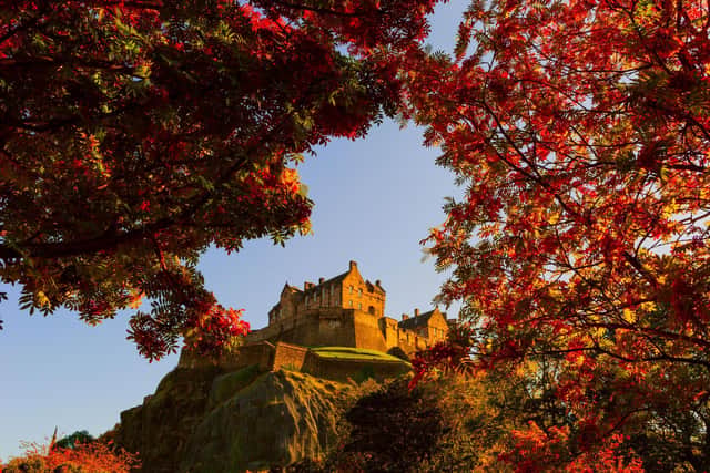 Edinburgh Castle framed by autumnal leaves – just the sort of image luring travellers to the city (Picture: stock.adobe.com)