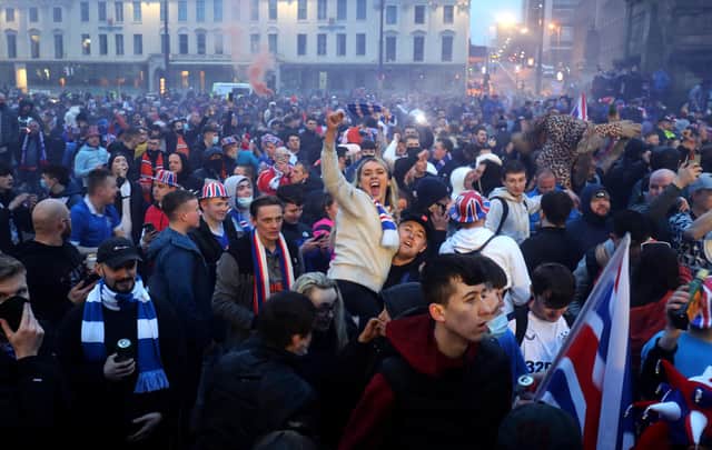 Rangers fans celebrate in George Square after Rangers win the Scottish Premiership title picture: PA/Jane Barlow