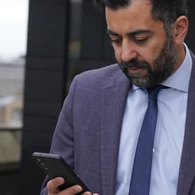 Scottish First Minister Humza Yousaf checks his phone during a visit to meet young people to discuss mental health support and mark Scottish Association for Mental Health's (SAMH) centenary, at the National Museum Of Scotland in Edinburgh.