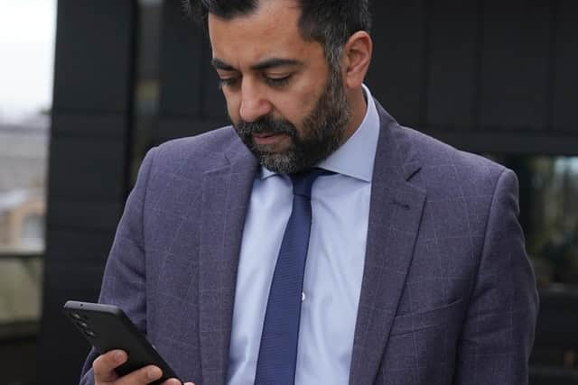 Scottish First Minister Humza Yousaf checks his phone during a visit to meet young people to discuss mental health support and mark Scottish Association for Mental Health's (SAMH) centenary, at the National Museum Of Scotland in Edinburgh.