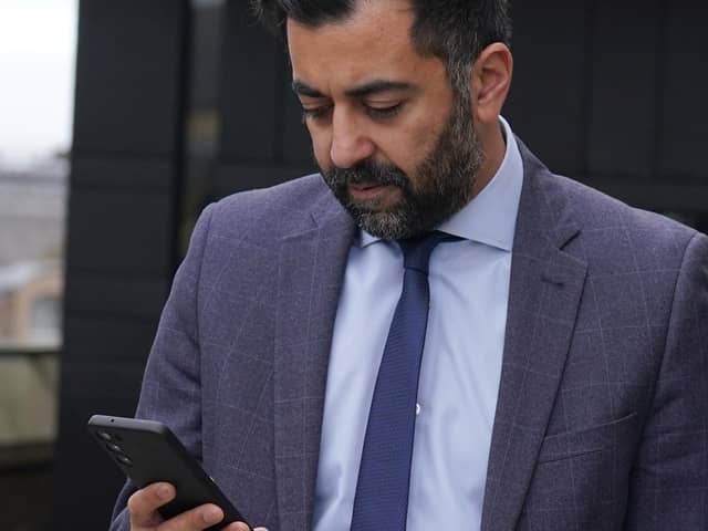 Scottish First Minister Humza Yousaf checks his phone during a visit to meet young people to discuss mental health support and mark Scottish Association for Mental Health's (SAMH) centenary, at the National Museum Of Scotland in Edinburgh.