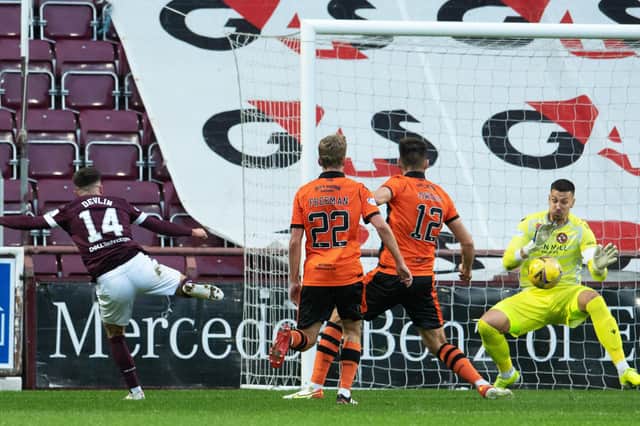 Benjamin Siegrist pulls off a good save from Cammy Devlin at Tynecastle.