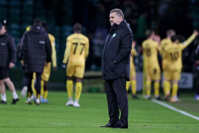 Celtic manager Ange Postecoglou is left dejected as Bodo/Glimt players celebrate their first leg win at Celtic Park. (Photo by Craig Williamson / SNS Group)