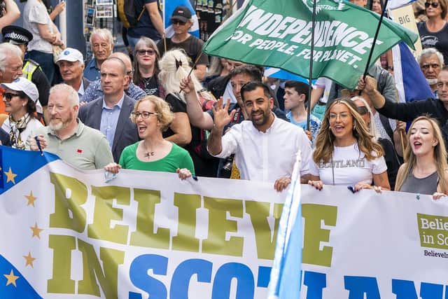 All smiles as Humza Yousaf and Scottish Green minister Lorna Slater take part in a pro-independence march, but others in the SNP are unhappy with the party's power-sharing deal (Picture: Jane Barlow/PA)