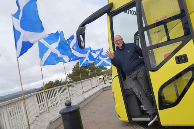 John Swinney, pictured on his campaign battle bus, looks set to lead the SNP to victory (Picture: Mike Boyd/PA)